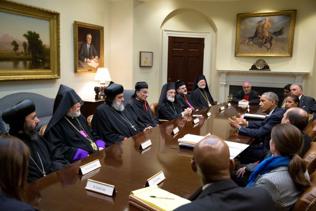 President Obama gestures during meeting with Lebanese cardinal and other religious religious leaders at White House