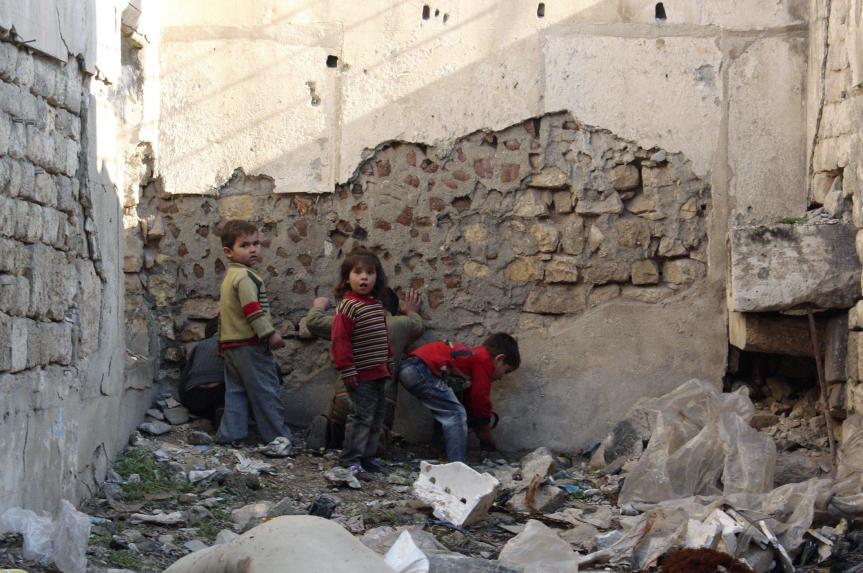 Children playing amidst the ruins in Aleppo, Syria